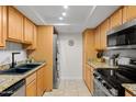 Kitchen with stainless steel appliances and washer/dryer at 3825 E Camelback Rd # 290, Phoenix, AZ 85018