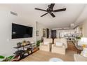 Living room with city views, comfortable seating, and open kitchen access at 4422 N 75Th St # 7009, Scottsdale, AZ 85251