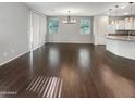 Bright dining room with hardwood floors and access to the kitchen at 4738 E Tierra Buena Ln, Phoenix, AZ 85032