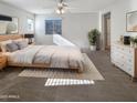 Large main bedroom with carpeted floors and a ceiling fan at 4738 E Tierra Buena Ln, Phoenix, AZ 85032