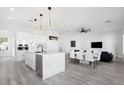 Modern kitchen with white cabinets, marble island, and stainless steel appliances at 47970 N Navidad Ct, Gold Canyon, AZ 85118