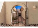 Ornate iron gate entry to private courtyard at 6147 E Lewis Ave, Scottsdale, AZ 85257