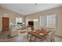 Bright dining room with contemporary furnishings and tile floors at 9665 E Friess Dr, Scottsdale, AZ 85260