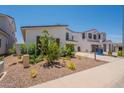 Contemporary home with a small front yard with desert landscaping at 11029 E Ulysses Ave, Mesa, AZ 85212