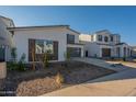 Modern home with a two-car garage and low-maintenance front yard landscaping at 11029 E Ulysses Ave, Mesa, AZ 85212