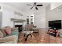 Living room features tiled floors, fireplace, and comfy seating at 1220 N Cliffside Dr, Gilbert, AZ 85234
