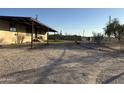 Side view of the home, showing covered patio area at 12629 S Tuthill Rd, Buckeye, AZ 85326