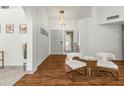 Elegant entryway with hardwood floors and modern light fixtures at 13454 N 88Th Pl, Scottsdale, AZ 85260