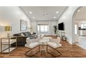 Bright and airy living room with hardwood floors and stylish furnishings at 13454 N 88Th Pl, Scottsdale, AZ 85260
