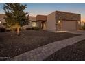 Stunning exterior of a single-story home with a stone facade and landscaped yard at 15848 E Palomino Blvd, Fountain Hills, AZ 85268