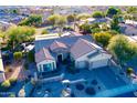 Single-story house with solar panels, a large backyard, and a two-car garage at 18059 W Tierra Del Sol Dr, Surprise, AZ 85387