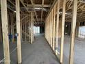 Spacious interior view of home under construction with exposed framing and open layout showcasing potential at 22820 E Lords Way, Queen Creek, AZ 85142