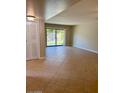 Bright living room with tile floors and sliding glass doors at 3655 N 5Th Ave # 106, Phoenix, AZ 85013