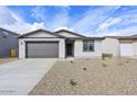 Charming single-story home featuring a well-manicured gravel front yard and a two-car garage at 4312 E Bradford Ave, San Tan Valley, AZ 85143