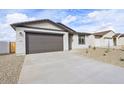 Attractive single-story home with a gravel front yard and a convenient two-car garage at 4312 E Bradford Ave, San Tan Valley, AZ 85143