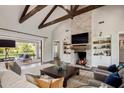 Open living space with a large fireplace and access to backyard patio at 4802 N 46Th St, Phoenix, AZ 85018