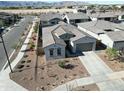 Aerial view of a house with a desert landscaping and two-car garage at 13172 N 174Th Dr, Surprise, AZ 85388