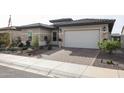 Single story home with a two car garage and desert landscaping at 15834 S 177Th Ave, Goodyear, AZ 85338