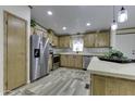 Modern kitchen featuring stainless steel appliances and wood cabinets at 17200 W Bell Rd # 1635, Surprise, AZ 85374