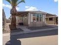 Inviting manufactured home with carport and landscaped yard at 205 S Higley Rd # 4, Mesa, AZ 85206