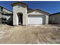 Home exterior shows a two car garage, desert landscaping, and a modern design at 22836 E Lords Way, Queen Creek, AZ 85142