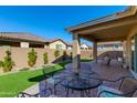 Patio furniture on brick pavers and green lawn at 24862 N 172Nd Ave, Surprise, AZ 85387