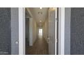 Inviting entryway featuring a long hallway with tile floors and recessed lighting at 2690 E Abe Truckle Ave, San Tan Valley, AZ 85140