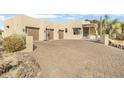 Front view of a beautiful home with a large driveway and basketball court at 39816 N 106Th Pl, Scottsdale, AZ 85262