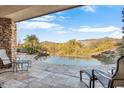 Relaxing pool area with mountain views and comfortable patio furniture at 39816 N 106Th Pl, Scottsdale, AZ 85262