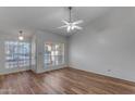 Living room with wood-look floors and lots of natural light at 4556 N 88Th Ave, Phoenix, AZ 85037