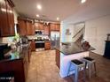 Modern kitchen with granite countertops and stainless steel appliances at 15936 W Canterbury Dr, Surprise, AZ 85379