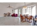 Bright dining area with a tiled floor and wooden chairs at 1715 N Silverado --, Mesa, AZ 85205