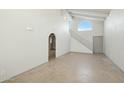 Spacious living area with high ceilings and tile floors at 2227 E Catalina Dr, Phoenix, AZ 85016