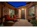 Charming courtyard with lounge chairs and brick flooring at 26398 W Cat Balue Dr, Buckeye, AZ 85396