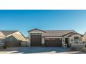 Single story home with 2 car garage and attractive curb appeal at 44049 W Palo Nuez St, Maricopa, AZ 85138