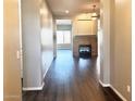 Spacious entryway with hardwood floors and a fireplace at 5822 E Bramble Berry Ln, Cave Creek, AZ 85331