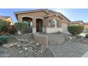 Charming curb appeal with a paved walkway and well-manicured landscaping at 1113 W Fir Tree Rd, San Tan Valley, AZ 85140