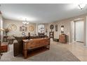 Bright and airy living room with ample natural light and comfortable seating at 1113 W Fir Tree Rd, Queen Creek, AZ 85140