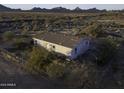 Aerial view of a single-story home with fenced yard in desert landscape at 12866 W Sun Ave, Eloy, AZ 85131