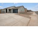 Charming single-story home with a two-car garage and stone accents on the facade at 2685 E Santa Ynez Dr, Casa Grande, AZ 85194