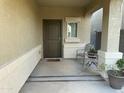 Small front porch with seating for two at 35262 W San Ildefanso Ave, Maricopa, AZ 85138