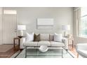 Living Room includes a sofa with bright lamps on side tables and modern art at 3830 E Lakewood E Pkwy # 2154, Phoenix, AZ 85048