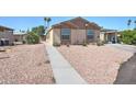Tan two-bedroom house with walkway and gravel landscaping at 6722 W Taylor St # 294, Phoenix, AZ 85043