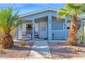 Mobile home with a covered porch and desert landscaping at 8500 E Southern Ave # 538, Mesa, AZ 85209