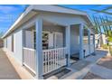Mobile home with covered porch and side yard view at 8500 E Southern Ave # 538, Mesa, AZ 85209