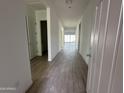 Bright hallway with tile flooring and access to other rooms at 11446 E Utah Ave, Mesa, AZ 85212