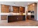 Spacious kitchen with dark wood cabinets and large island at 1364 E Nolan Pl, Chandler, AZ 85249