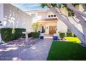 Inviting front entry with landscaping, fountain, and artificial turf at 15021 N 19Th Way, Phoenix, AZ 85022