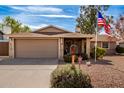 House exterior featuring a two-car garage and neat landscaping at 1511 W El Monte Pl, Chandler, AZ 85224