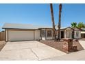 Single story home with a two car garage and a brick mailbox at 1527 W Rosemonte Dr, Phoenix, AZ 85027